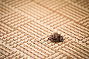 Uninhabited Coffee Scene Prints: Some coffee beans on a squared tablecloth