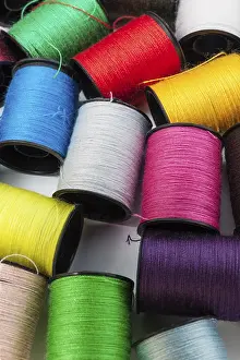 Colorful Threads Prints: Colorful threads on spools close up