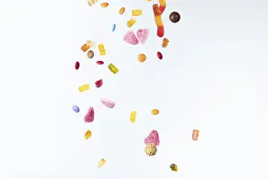 White Background Sweets Prints: Colourful sweets fall against a white background
