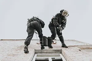 SWAT Team Exercises Prints: Two commandos train at the base