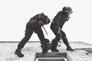 SWAT Team Exercises Prints: Two commandos train at the base