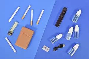 Transporting Goods By Sea Prints: Comparison between electronic and real cigarette with tools