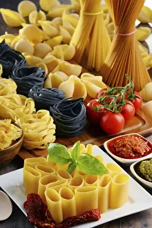 Diverse Pasta Dishes Prints: Composition with different sorts of pasta on kitchen table