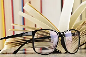 Literature And Wisdom Concept Prints: Composition with glasses and books on the table