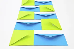 Empty Office Desk Prints: Composition with green and blue envelopes on the white table