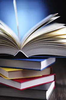 University College Study Space Prints: A composition with an open book lying on a stack of other books