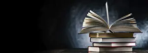 University College Study Space Prints: A composition with an open book lying on a stack of other books