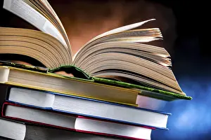 Educational Institution Prints: A composition with an open book lying on a stack of other books