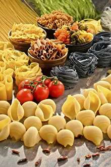 Tomato Based Pasta Recipes Prints: Composition with variety of pasta on kitchen table
