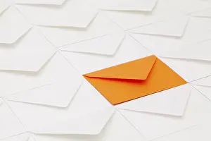 Empty Office Desk Setup Prints: Composition with white envelopes and one orange envelope on the table