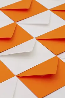Empty Office Desk Prints: Composition with white and orange envelopes on the table