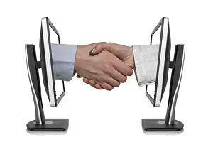 Workplace Communication Prints: Two computer monitors and hands in handshaking