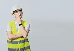 Young Construction Worker Prints: Concept of a meditative engineer solated