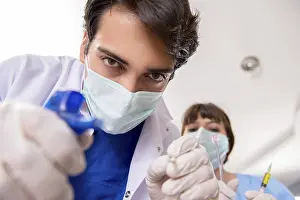 Dental Care Professional Prints: Concept of treating teeth at dentists