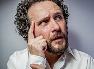 White Background Studio Shots Prints: Concern for the future, man with intense expression