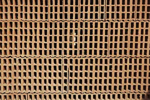 Uninhabited Building Site Prints: Construction bricks stacked red clay brick
