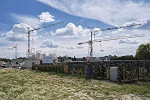 Central Europe Urban Environment Prints: Construction cranes in a new development area