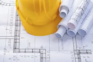 Construction Helmet Prints: Construction helmet and blueprints with copyspace horizontal version