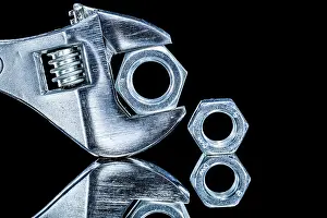 Adjustable Spanner Prints: Construction nuts adjustable spanners on black background