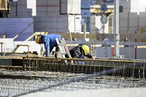 Construction Site Work Prints: Construction work on the foundations of a large apartment building