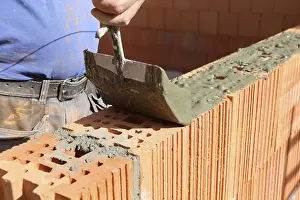 Handicraft Industry Prints: Construction worker (bricklayer) on the building site
