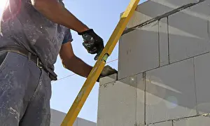 New Building Site Prints: Construction worker (bricklayer) on the building site