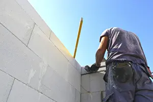 Bricklayer Detail Prints: Construction worker (bricklayer) on the building site