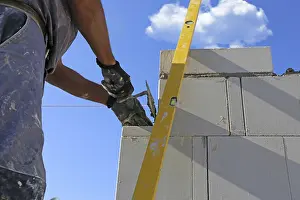 New Building Site Prints: Construction worker (bricklayer) on the building site