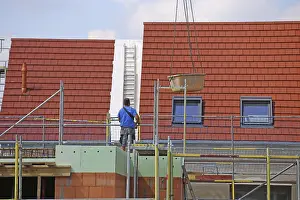 Bricklayer Detail Prints: Construction worker (bricklayer) on the building site (Mutterstadt development area)