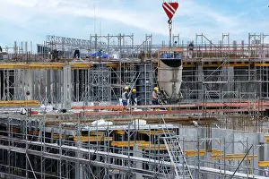 Large Construction Sites Prints: Construction worker on a large building site