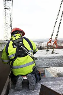 Protective Clothing Prints: Construction worker working outside building