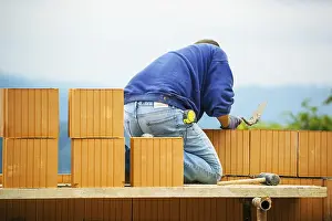 Construction Worker Prints: Construction workers erecting a brick shell
