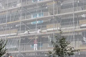 Building Renovation Prints: Construction workers among scaffolding