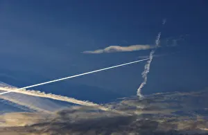 Aviation Industry Europe Prints: Contrails intersect in the evening sky
