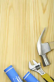 Construction Plan Prints: Copyspace image of hammer spanner and blueprints