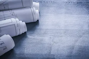 Rolled Up Blueprints Prints: Copyspace image five rolls of blueprints very close up