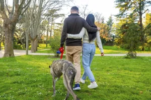 Happy Couple With Dog Prints: Couple affectionately embracing