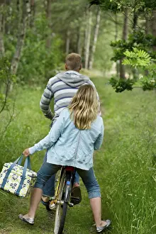 Scandinavian Landscape Photography Prints: Couple on one bicycle