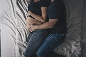 Couple In Bed Prints: A couple is lying in bed
