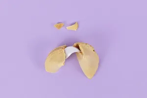 Uninhabited Dessert Scene Prints: Cracked fortune cookie with note without text