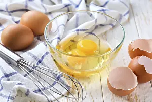 Prints of Cracked raw eggs on a light-colored kitchen table, selective focus. Natural farm chicken eggs on a white table, selective focus. Cooking scrambled fresh eggs for breakfast Related Prints: Raw Eggs on a Light-Colored Kitchen Table Print