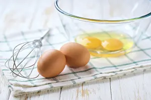 Food Nutrition Facts Prints: Cracked raw eggs on a light-colored kitchen table