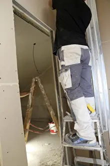 Manpower In Construction Prints: Craftsmen doing drywall work