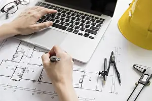 Modern Architecture Design Prints: Crop hands using laptop drawing draft