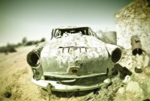 Deserted Passenger Car Prints: Cross processed image of an old car
