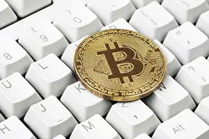 Bitcoin Symbol Prints: Cryptocurrency on computer keyboard