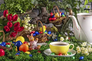 Easter Bunny Figurine Prints: A cup of coffee next to a coffee pot surrounded by springtime Easter decorations