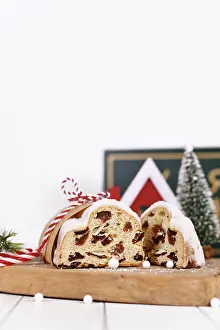 Christmas Time Desserts Prints: Cut open German Stollen cake, a fruit bread with nuts