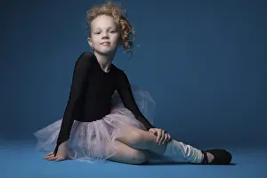 Elegant Female Ballet Dancer Prints: Cute curly ballet dancer posing in studio