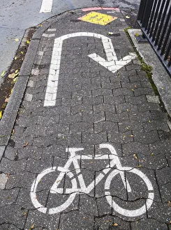 Road Safety Markings Prints: Cycle path marking on a pavement